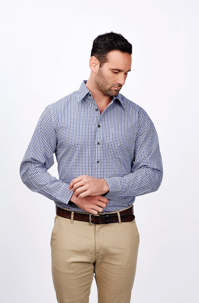 A men's long sleeve shirt featuring a blue and white checkered pattern, complemented by a brown belt and cream trousers.