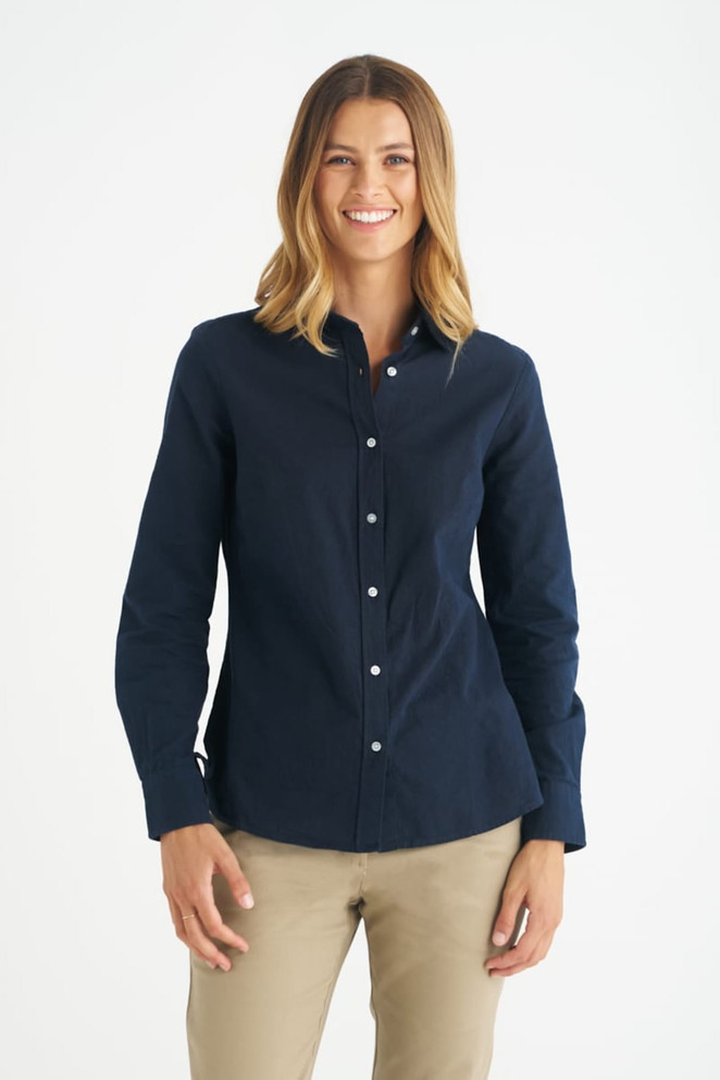 A navy blue long sleeve ladies button-up shirt with a collar and a logo.