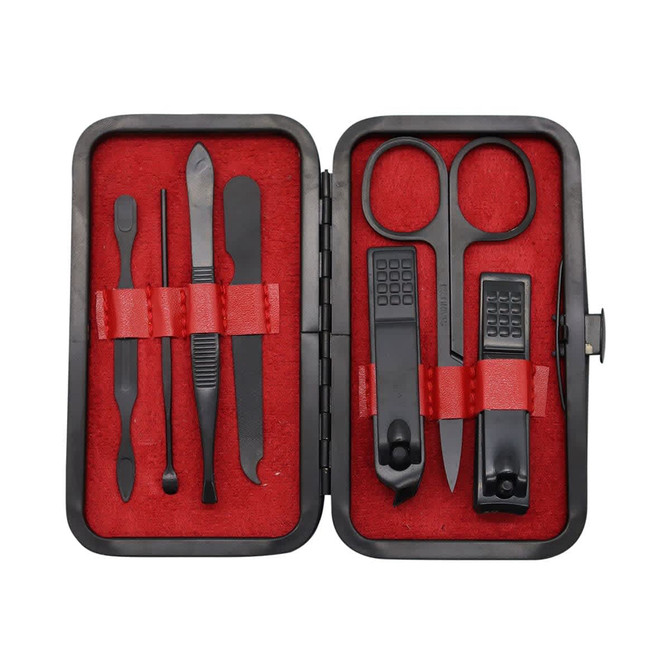 A black manicure set with red lining, containing scissors, clippers, tweezers, and various nail tools, presented in a compact case.