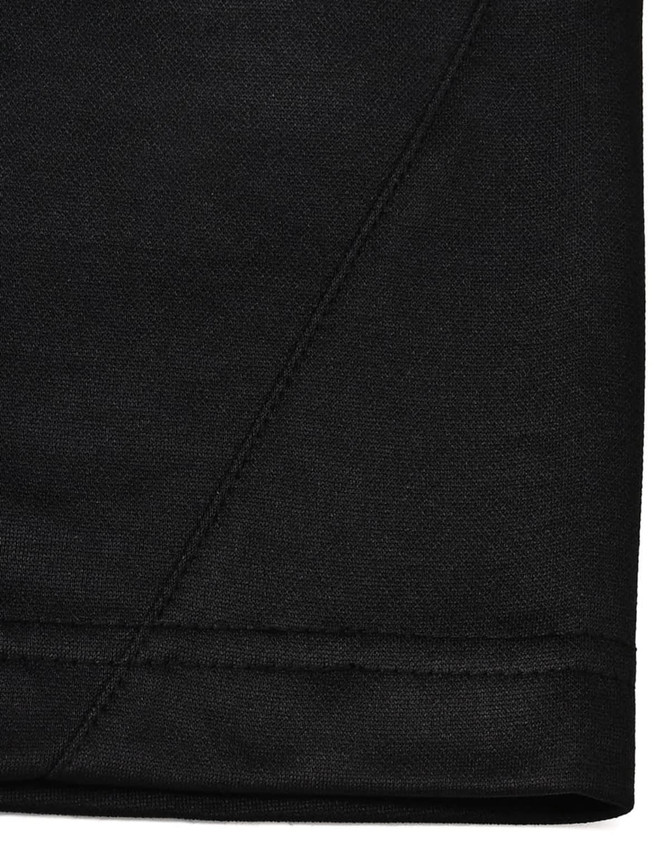 A close-up view of the hem of a black polo shirt, featuring subtle stitching details and a logo.