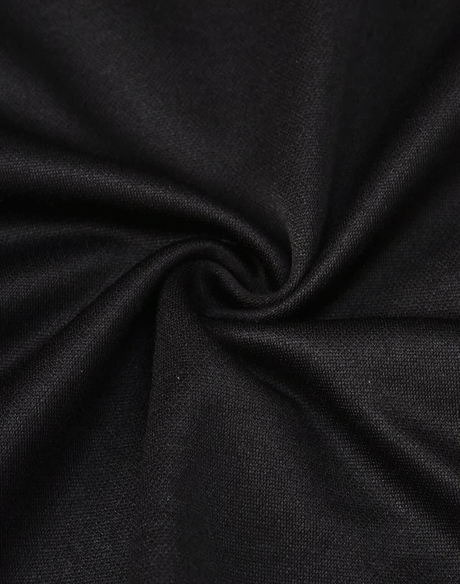 A close-up view of black sustainable poly/cotton fabric, showcasing its smooth texture and flexibility.