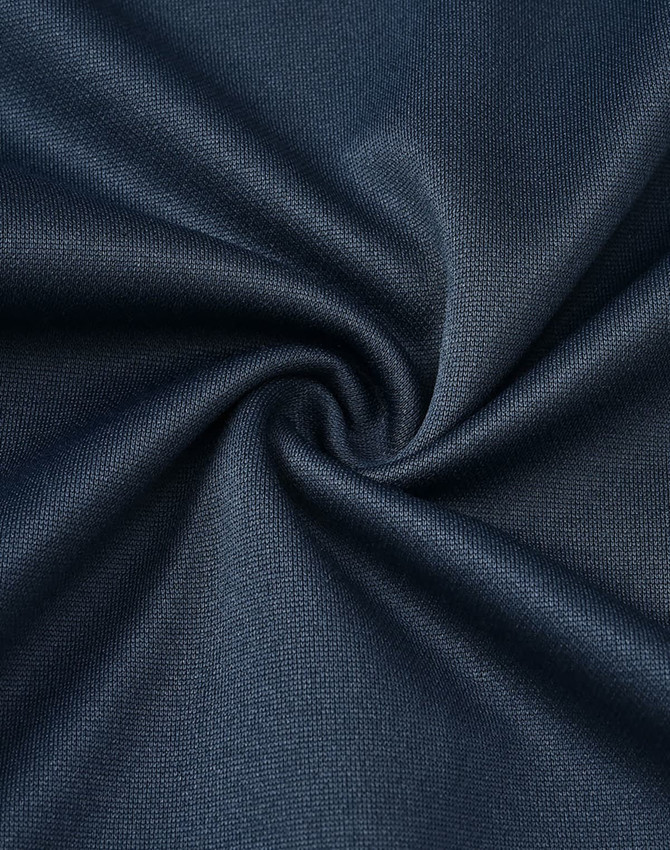 A close-up of navy fabric, featuring a smooth, textured surface with a subtle sheen.