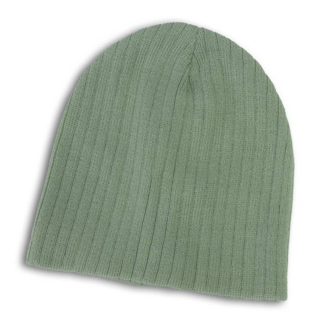 A Nebraska Cable Knit Beanie in a soft green color, featuring a ribbed texture.