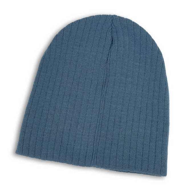 A Nebraska Cable Knit Beanie in a soft blue color with a textured ribbed pattern.