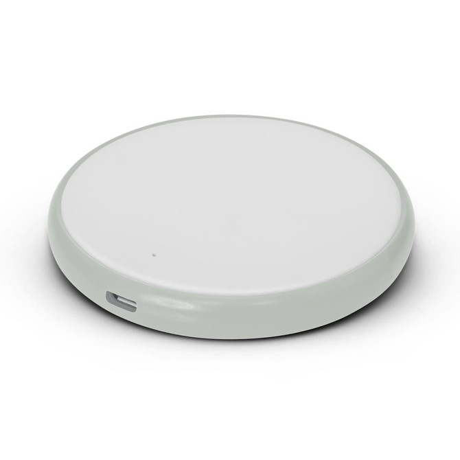 A round wireless charger in a sleek, minimal design with a smooth surface and a USB-C port.