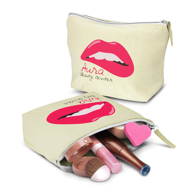 A medium cosmetic bag in light yellow with a pink lip design, containing various makeup items inside.