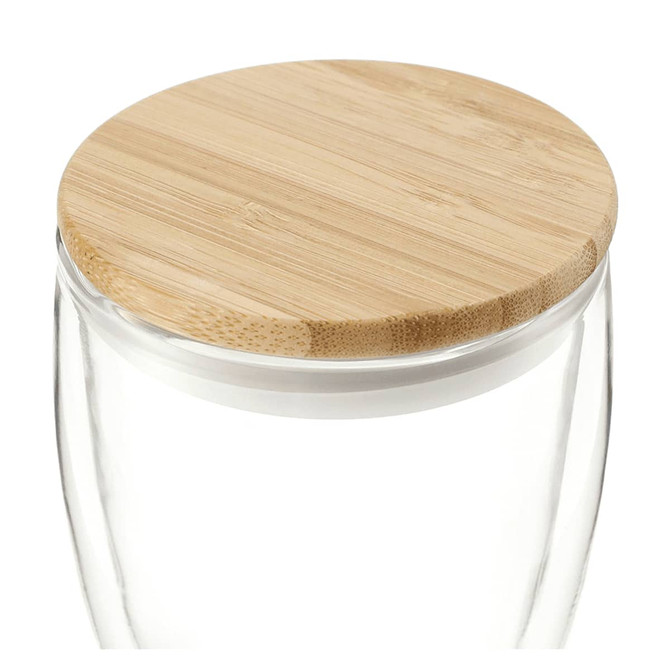 A drink cup featuring clear glass with a natural bamboo lid, designed for beverages. It has a simple, modern look.