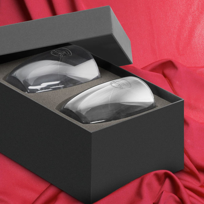 A double wall glass set in a black box, featuring two clear glasses resting on a grey inner lining.