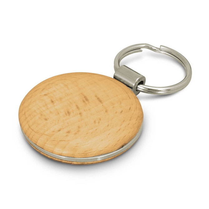 A round wooden key ring with a silver metal keychain attachment. The wood has a light, natural finish.