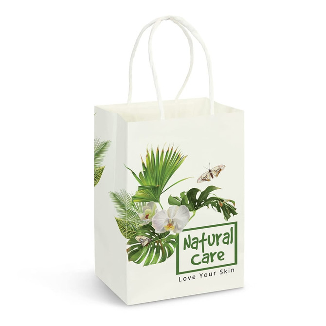 A small white paper carry bag featuring a floral and leaf design, with two handles and a logo.