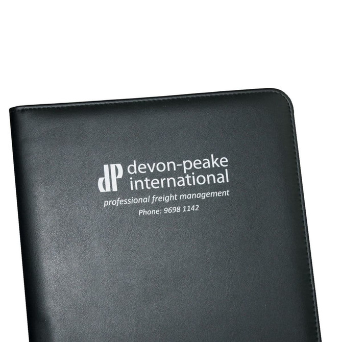 A black A4 pad cover features a logo on the front, suitable for office use in a professional setting.