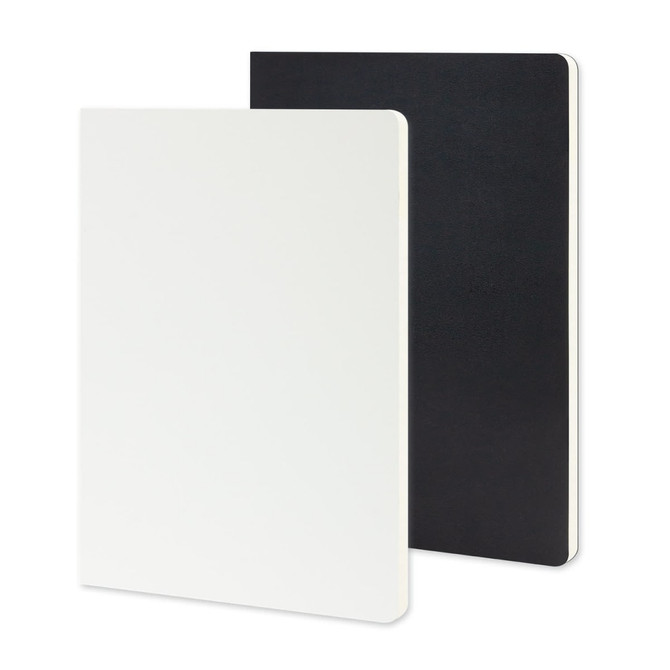 A large Moleskine Volant journal in white and black with smooth covers and rounded corners.