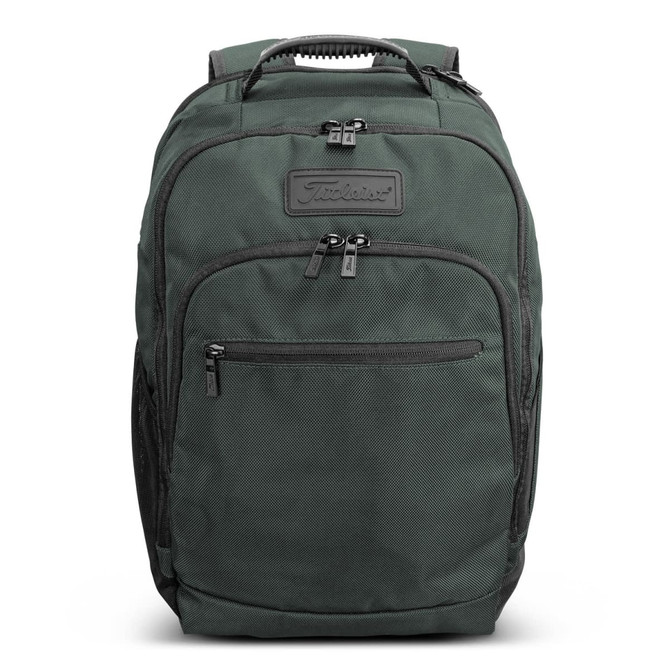 A dark green backpack with multiple zippered compartments and a logo on the front.