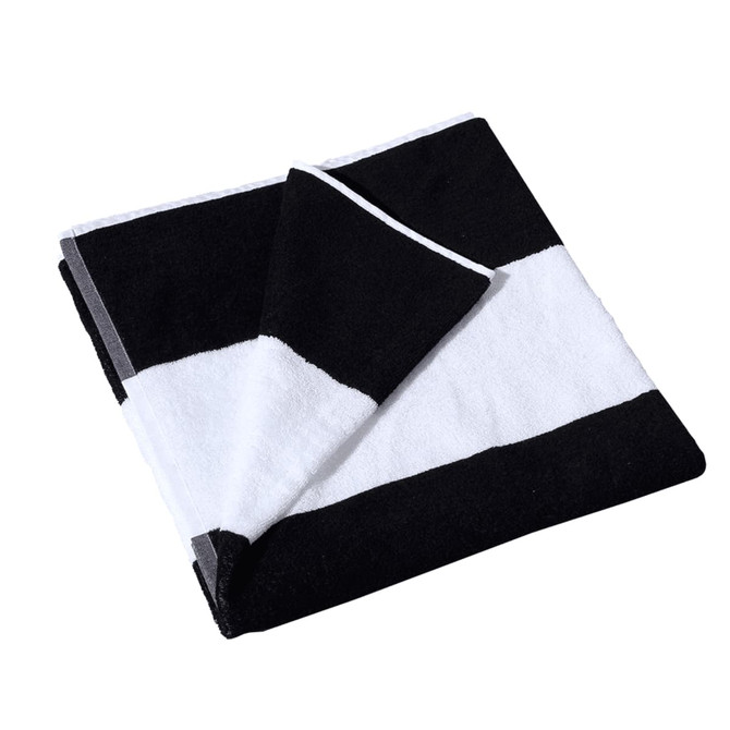 A folded cotton beach towel featuring bold black and white stripes, with a branded logo.