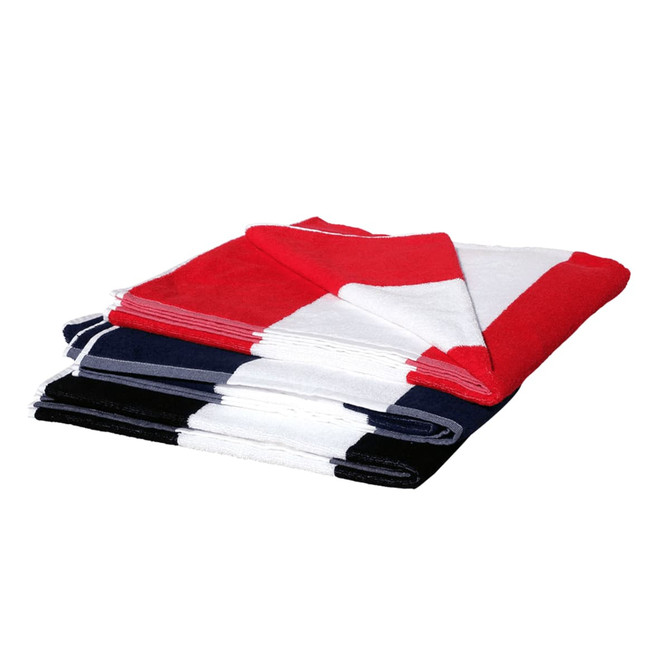 A stack of cotton beach towels in red, white, and navy blue, featuring a logo on one towel.