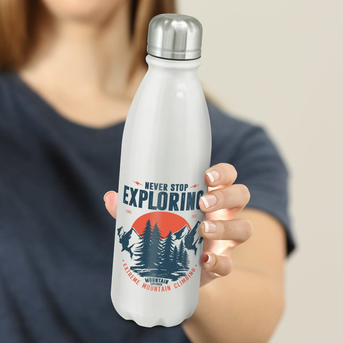A drink bottle with a sleek white design, a silver lid, and a nature-themed logo featuring mountains and trees.