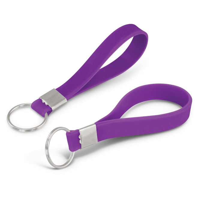 A purple silicone key ring with a debossed design and a metal keyring attachment.