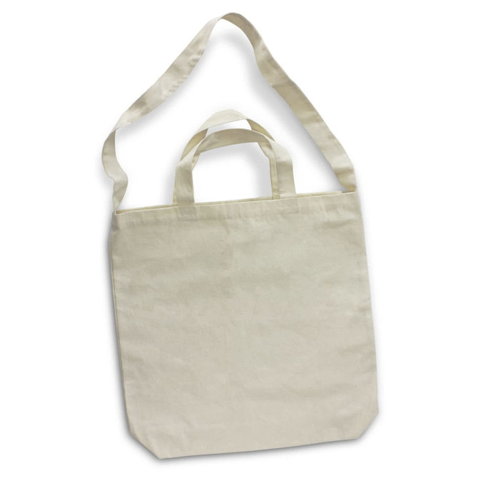 A cream-coloured cotton shoulder tote bag with long straps and short handles, featuring a subtle logo.
