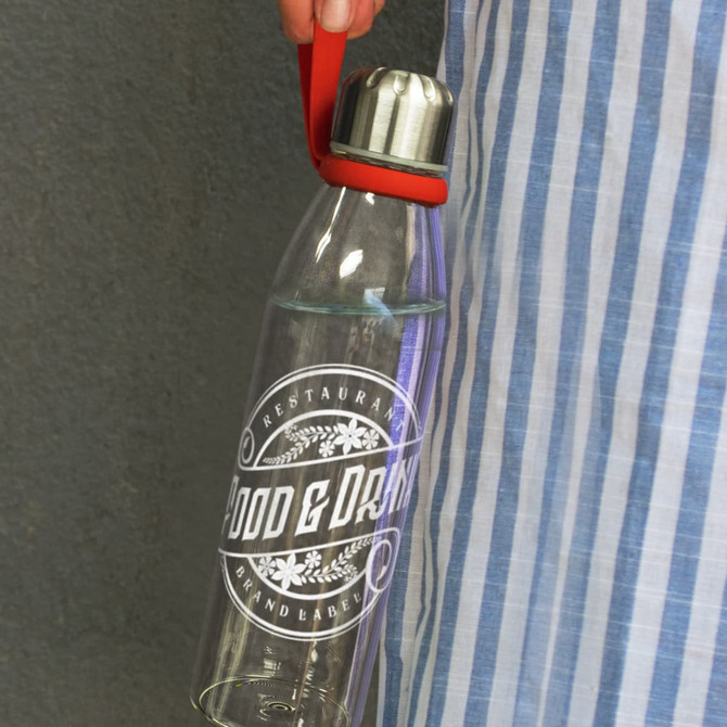 A drink bottle with a transparent glass body, silver lid, and a red carrying strap, featuring a branding logo.