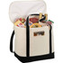 A cotton cooler bag in cream and black, filled with drinks and snacks, featuring two sturdy handles.