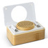 A bamboo wireless speaker and earbud set in a compact wooden case with a transparent lid.