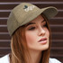 A cap in khaki with a branded logo, featuring a curved peak and textured fabric, worn by a model.
