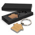 A house-shaped key ring with a wooden centre and a silver metal keyring, presented in a black gift box.