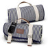 A blue and white striped picnic blanket rolled up, featuring a carrying handle and a logo tag.