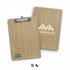A bamboo clipboard with a silver clip, featuring a logo on one side and a natural wood finish.