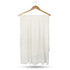 A white compressed towel hanging on a wooden hanger, featuring a textured surface and a simple design.