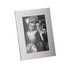 A classic aluminium photo frame in silver, featuring a portrait orientation and an image of two children.