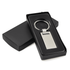 A sleek silver keychain presented in a black gift box, featuring a rectangular tag and a circular ring.