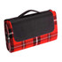 A red and black plaid picnic rug with a black handle for easy carrying. It features a foldable design.