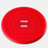 A red silicone frisbee featuring a central logo area and smooth, rounded edges.