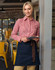A denim half apron in dark blue with a brown tie, worn over a red and white checkered shirt.