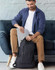 A black executive backpack featuring adjustable straps and mesh side pockets for storage.