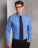 A blue long sleeve button-up shirt featuring a chest pocket and paired with a dark tie. The model is wearing glasses.