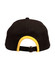 A black cap with a yellow trim at the back, featuring an adjustable strap and a logo.