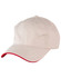 A beige cap with a contrasting red peak, featuring ventilation holes and a logo.