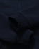 A navy blue kid's full-zip fleecy hoodie with a soft texture and cuffed sleeves. Features a logo.