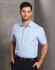 A light blue men's short sleeve button-up shirt with a chest pocket and a logo.