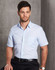 A light blue short-sleeve button-up shirt with a chest pocket, displayed on a model against a textured background.