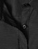 A close-up of a black ladies' button-up shirt with a pin dot pattern and a visible button.