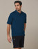 Men's utility cargo shorts in black, featuring pockets and a logo, paired with a navy polo shirt.