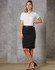 A woman poses in a fitted black wool stretch pencil skirt with a white top against a textured grey background.