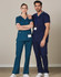 Two individuals wearing solid colour scrub pants—one in teal and the other in navy—standing side by side.