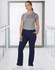 Ladies' solid colour scrub pants in navy, worn with a grey top, featuring a logo on the top.