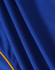 A close-up of a blue polo shirt with textured fabric and yellow accents, featuring a logo.