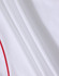 A close-up of a white polo shirt fabric with red piping and a logo.