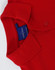A red men's cotton stretch polo shirt with a folded collar and a visible label.